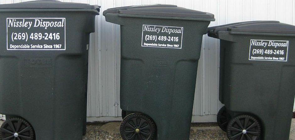 Photo of residential waste carts in three sizes
